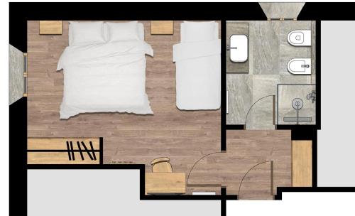 a floor plan of a bedroom with a bed at Hotel Sant'Orso - Mountain Lodge & Spa in Cogne