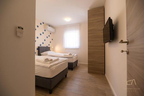 Ένα ή περισσότερα κρεβάτια σε δωμάτιο στο Luxury Apartments Loma