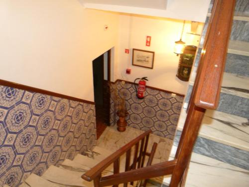 a stairway with a wooden railing and a stair case at Miradouro da Serra in Monchique