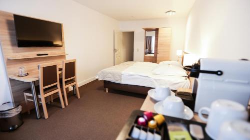 Postel nebo postele na pokoji v ubytování Hotel Waldhalle
