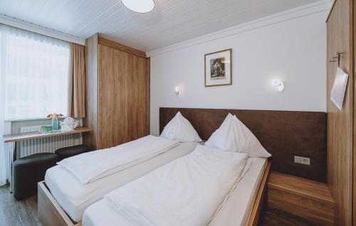 Ein Bett oder Betten in einem Zimmer der Unterkunft Pension Zimpasser