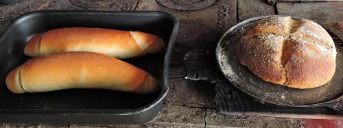 two loaves of bread sitting in a pan next to a pan with a loaf at Eco-Cabañas Altozano Nimaima in Nimaima