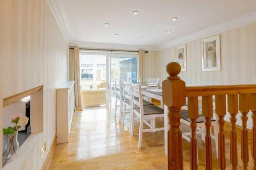 a living room with a table and a fireplace at Comfy Home- Coley Park in Reading
