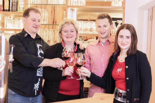 a group of people holding glasses of wine at Gasthof Aigner *** in Fügen
