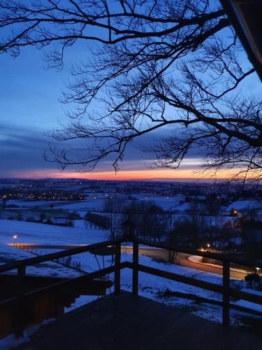 a view of the sunset from the porch of a house at Chalet de la Sablière in Amougies