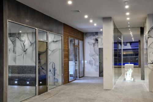 a lobby of a building with glass doors at SPA Resort St Ivan Rilski - Halfboard & All Inclusive in Bansko