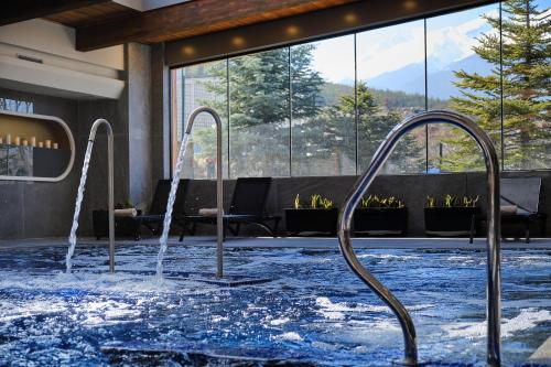 a pool with water fountains in a hotel lobby at SPA Resort St Ivan Rilski - Halfboard & All Inclusive in Bansko
