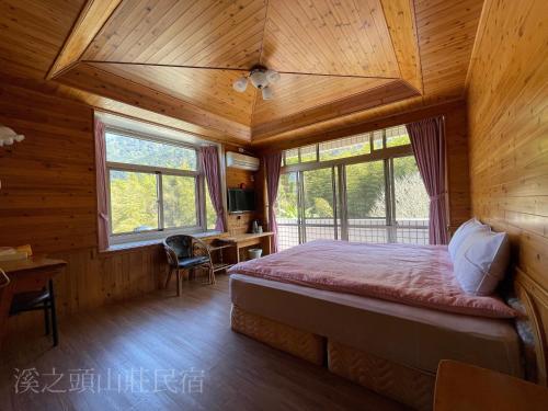Postel nebo postele na pokoji v ubytování Xi Zhi Tou Homestay