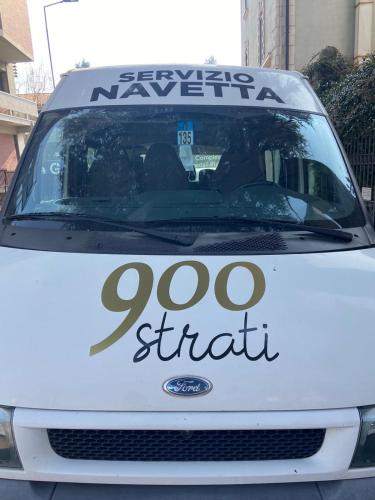 a white car with a sign on the front at ALBERGO 900Strati in Bergamo