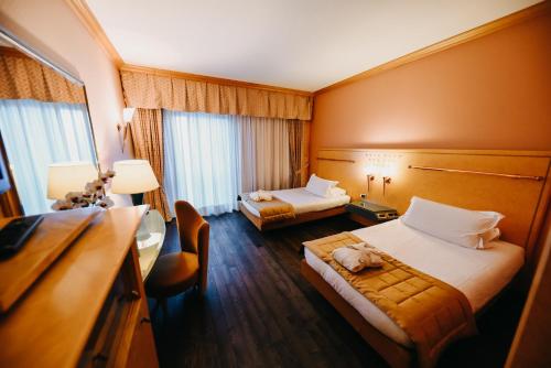 Una cama o camas en una habitación de SHG Hotel Antonella