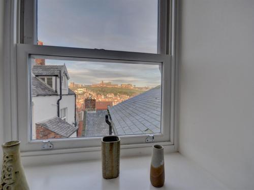 a window with a view of a city at The Old Auction Rooms Lot 2 Central with Private Parking in Whitby
