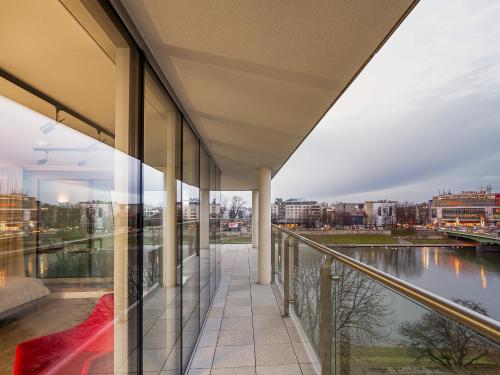 a view from the balcony of a building at Riverside Aparthotel Cracow in Kraków