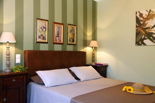 a bedroom with a bed with a hat on it at Anthias Garden in Lefkada Town