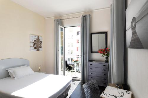 Postel nebo postele na pokoji v ubytování Hotel Marengo