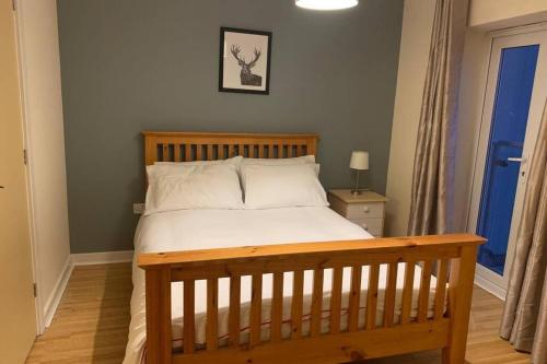 Ένα ή περισσότερα κρεβάτια σε δωμάτιο στο Harbour Beach Apartment