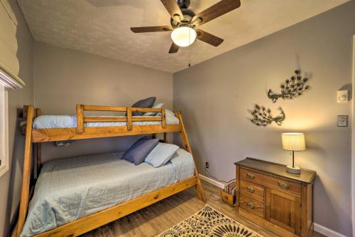 a bedroom with a bunk bed and a ceiling fan at Nature Escape in Wytheville with Covered Porch! in Wytheville