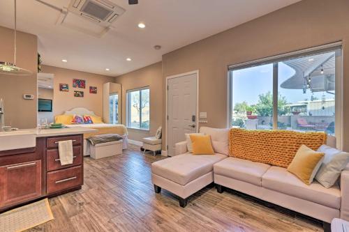 a living room with a couch and a bed at Modern Sun City Studio Near Deer Valley Golf in Sun City West