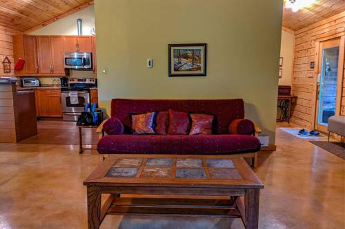 a living room with a couch and a coffee table at Chalet Le Boisé in Wakefield