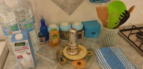 a kitchen counter with a blender and other kitchen items at Abbronzatissima Capo d'Orlando in Capo dʼOrlando