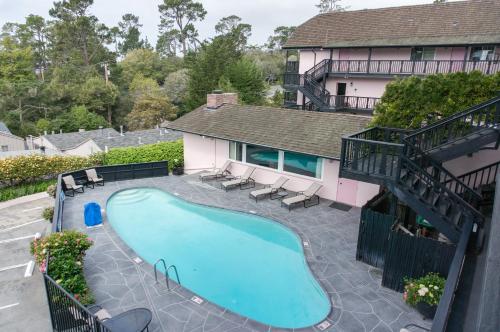 an overhead view of a swimming pool in front of a house at Hofsas House Hotel in Carmel
