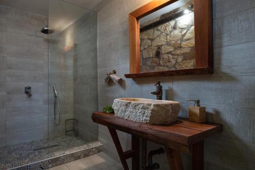 a bathroom with a sink and a shower at Niriides in Porto Koufo