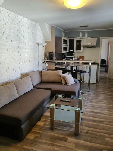 a living room with a couch and a table at Mostowa 3 in Bydgoszcz