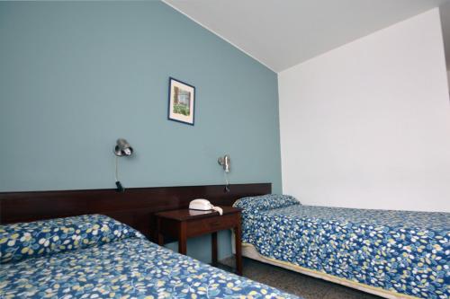 Voodi või voodid majutusasutuse Hotel Español Salto toas