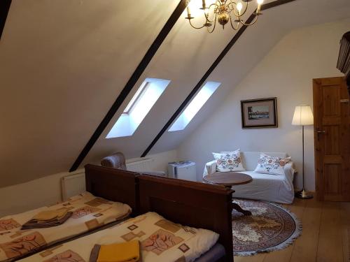 Postel nebo postele na pokoji v ubytování Apartmány U sv. Floriána