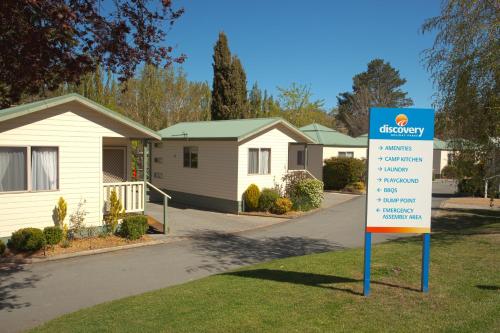 a sign in a yard in front of a house at Discovery Parks - Jindabyne in Jindabyne