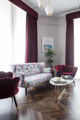 a living room with a couch and a table at The Wilder in Dublin