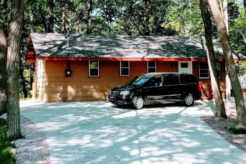 a black van parked in front of a house at Wisconsin Dells Cabin in the Woods - VLD0423 in Wisconsin Dells