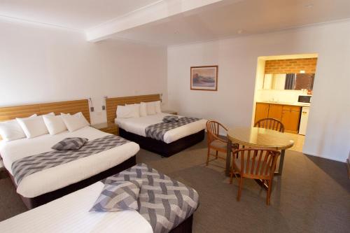 Ένα ή περισσότερα κρεβάτια σε δωμάτιο στο Albury Paddlesteamer Motel