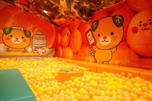 a display of oranges with winnie the pooh and grapes at Dogo Prince Hotel in Matsuyama