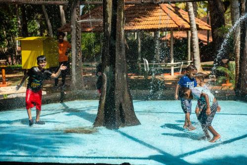 a group of children playing in a water park at GoGo Land Resort & Adventurous Sports in Pūvār