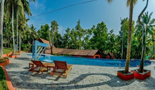 a swimming pool with chairs and a resort at GoGo Land Resort & Adventurous Sports in Pūvār