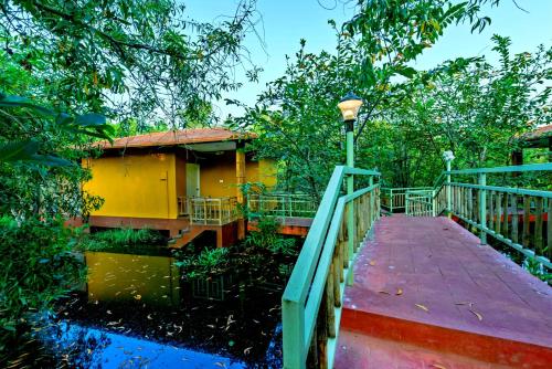a walkway leading to a building with a street light at GoGo Land Resort & Adventurous Sports in Pūvār