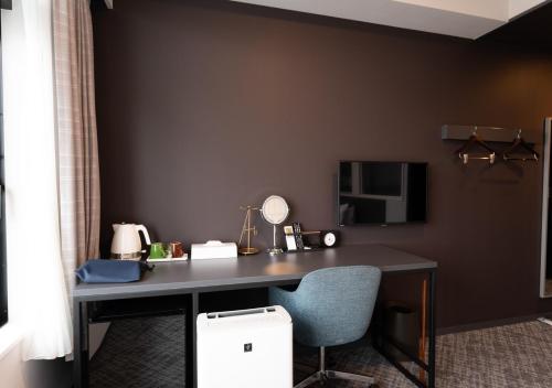 Televisyen dan/atau pusat hiburan di Hotel Cocktail Stay Naha