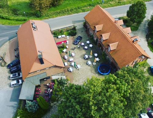 an overhead view of a building with cars parked in a parking lot at Zur Goldenen Kartoffel in Prötzel