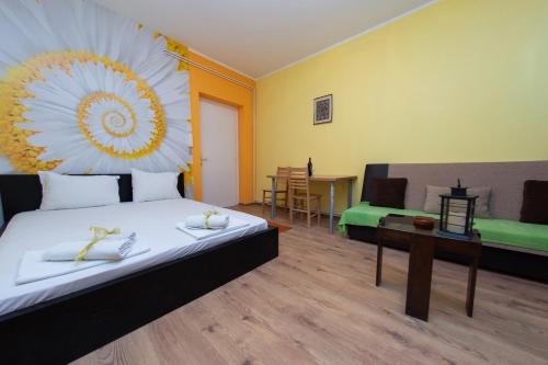 a room with a bed and a table and a couch at Apartment Kalemegdan in Belgrade