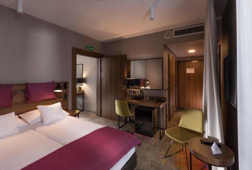 Postel nebo postele na pokoji v ubytování Hotel Sadova