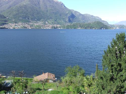 a view of a large body of water with mountains at Hotel Helvetia in Lezzeno