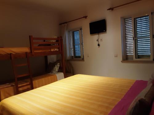 a bedroom with a bed and a bunk bed at SOL & MAR in Lagos