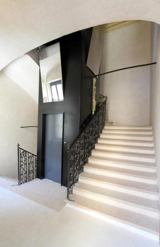 a staircase in a building with a stair case at Le Residenze di Mantova in Mantova
