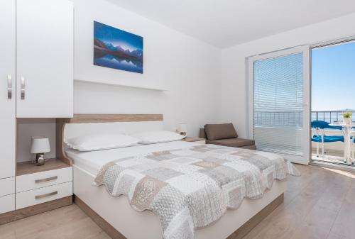 Postel nebo postele na pokoji v ubytování Apartmani Katarina