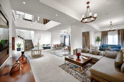 a living room with a couch and a table at Tolip North Coast Hotel in El Alamein