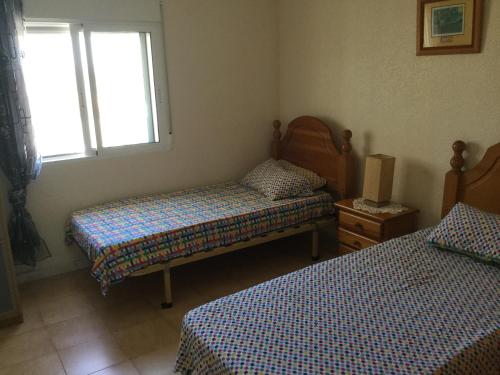 Un ou plusieurs lits dans un hébergement de l'établissement Detached-Extended- Villa à la Marina