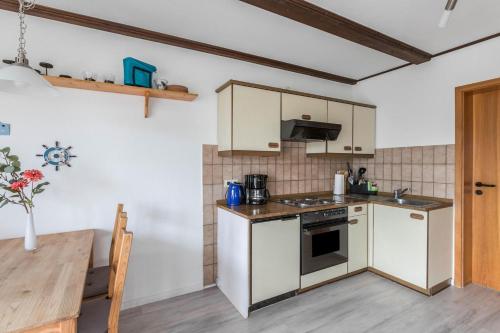 Kuchyň nebo kuchyňský kout v ubytování Ferienwohnung Nordseeperle