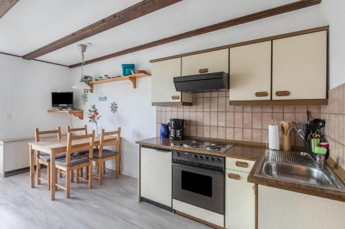 Kuchyň nebo kuchyňský kout v ubytování Ferienwohnung Nordseeperle