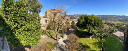 an aerial view of an old building and trees at Hotel Rural Quinta das Quintães in Penafiel