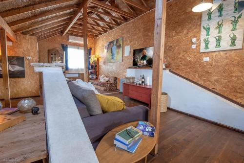 a living room with a couch and a table at Healing Hands in Merom Golan